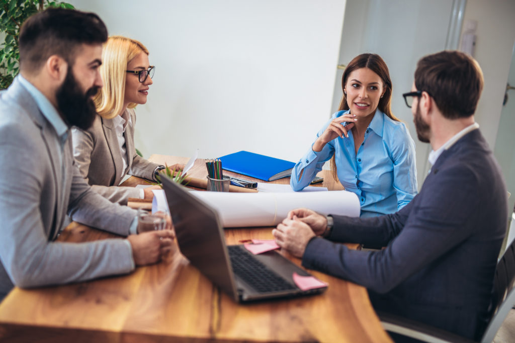 Business team discussing strategy around a conference table