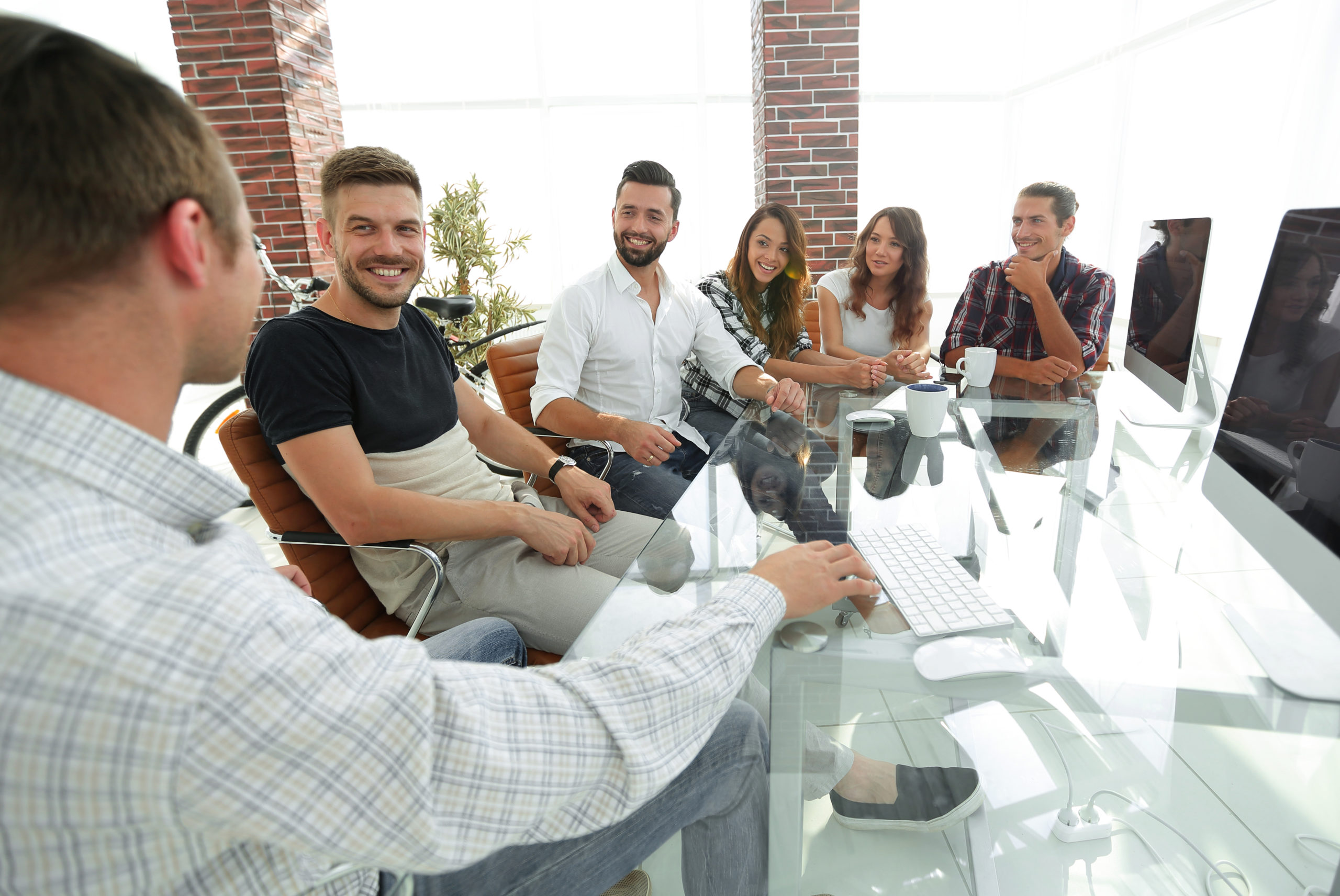 business team sitting at a modern Desk.