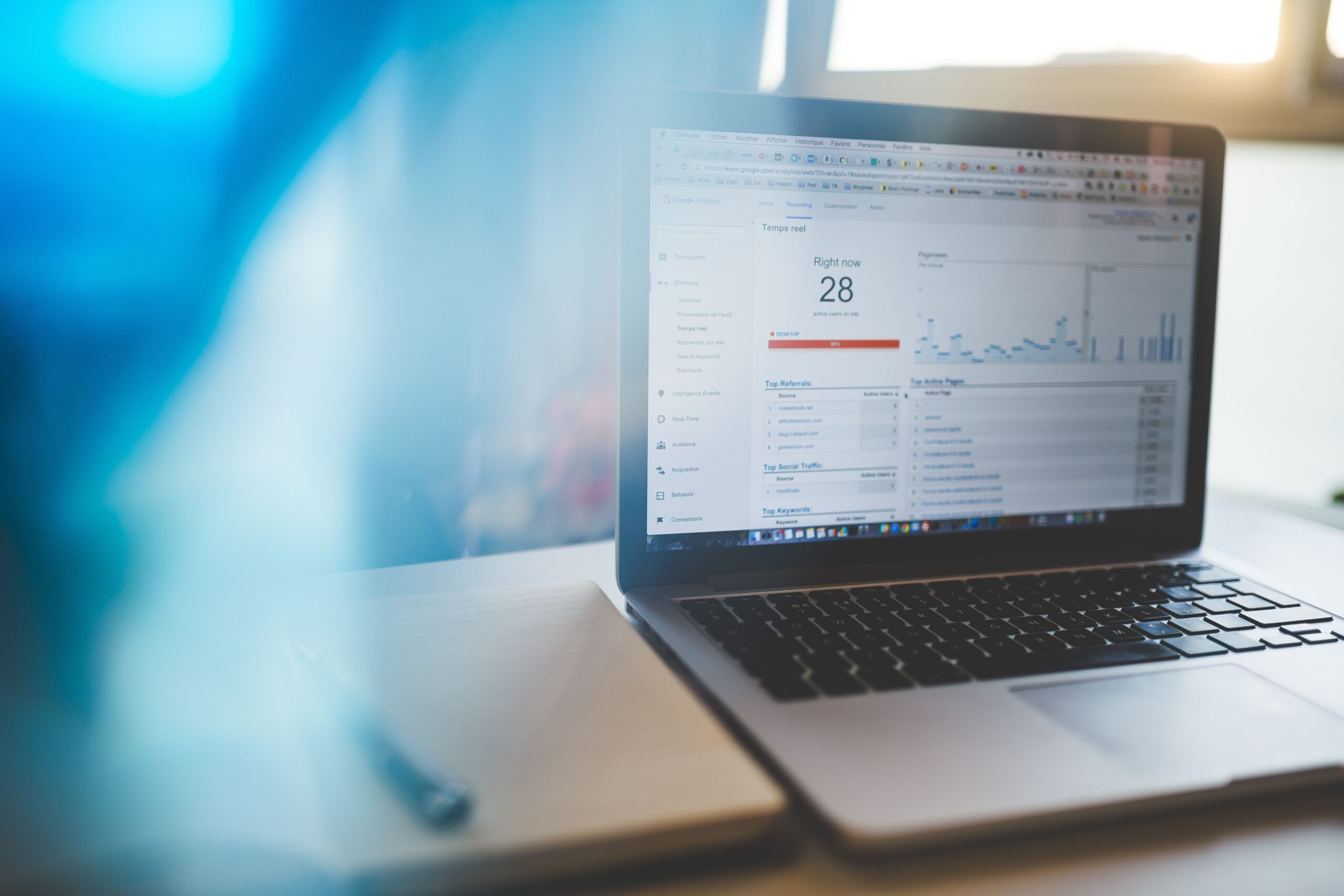 Laptop displaying an analytics dashboard on a desk