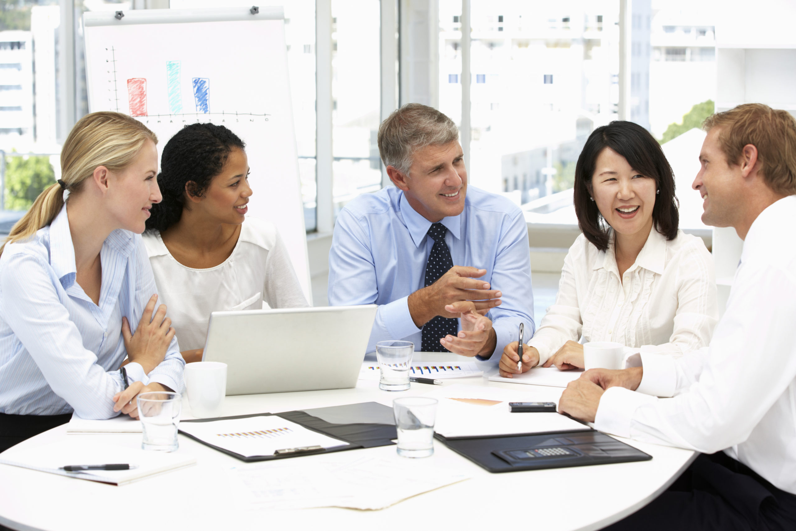 Diverse business team meeting around a conference table
